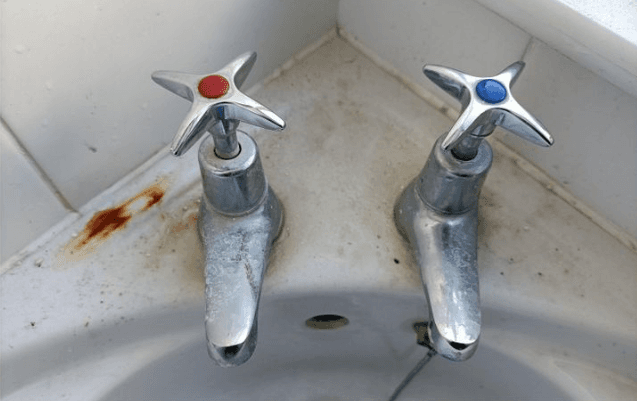 Bathroom taps before cleaning